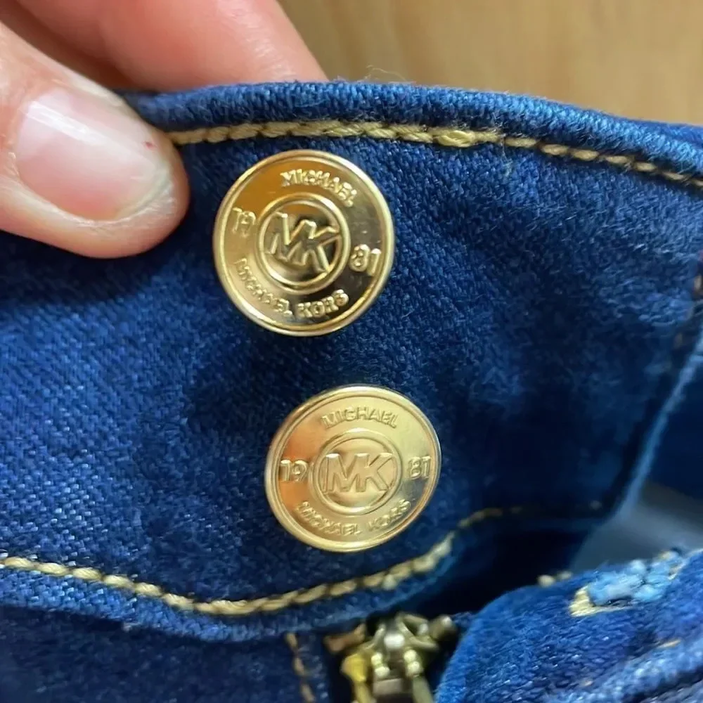 Michael Kors woman’s dark blue jeans. They are a size 10